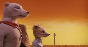 Movie still from “Fantastic Mr. Fox” (2009), directed by Wes Anderson – Two dogs wearing animal head costumes in a field; Close Up shot, Low angle