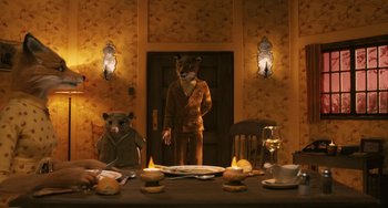 Movie still from “Fantastic Mr. Fox” (2009), directed by Wes Anderson – A man and a woman dressed as a bear and a bear in a room; Medium shot, High angle