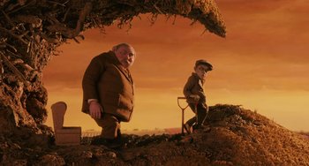 Movie still from “Fantastic Mr. Fox” (2009), directed by Wes Anderson – Two men are standing on a pile of dirt; Wide shot, Low angle