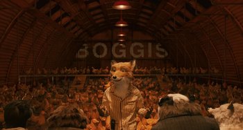 Movie still from “Fantastic Mr. Fox” (2009), directed by Wes Anderson – A man with a fox mask in front of a crowd of people; Wide shot, Over the shoulder angle