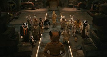 Movie still from “Fantastic Mr. Fox” (2009), directed by Wes Anderson – A group of people dressed in animal costumes; Wide shot, High angle