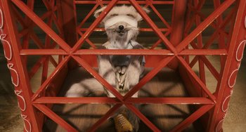 Movie still from “Fantastic Mr. Fox” (2009), directed by Wes Anderson – A dog sitting on top of a red metal structure; Close Up shot, High angle