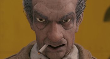 Movie still from “Fantastic Mr. Fox” (2009), directed by Wes Anderson – A person holding a cigarette in his mouth; Extreme Close Up shot, Low angle