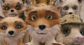 Movie still from “Fantastic Mr. Fox” (2009), directed by Wes Anderson – A stuffed animal fox with other stuffed animals in the background; Close Up shot, Overhead angle