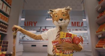 Movie still from “Fantastic Mr. Fox” (2009), directed by Wes Anderson – A man dressed as a fox holding a bag of apples; Medium shot, Low angle