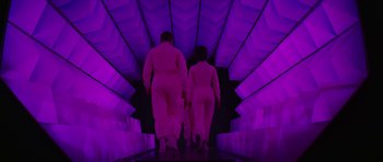 Movie still from “Fantastic Voyage” (1966), directed by Richard Fleischer – A couple of people that are walking down the stairs; Wide shot, Low angle