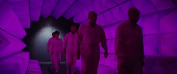Movie still from “Fantastic Voyage” (1966), directed by Richard Fleischer – A group of people walking in a room with purple lighting; Wide shot, Low angle