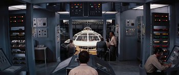 Movie still from “Fantastic Voyage” (1966), directed by Richard Fleischer – A group of people standing in a room; Wide shot, High angle