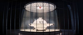 Movie still from “Fantastic Voyage” (1966), directed by Richard Fleischer – An image of an airplane inside a cage; Extreme Wide shot, Low angle