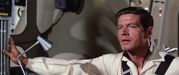 Movie still from “Fantastic Voyage” (1966), directed by Richard Fleischer – A person wearing a suit and tie; Close Up shot, Low angle