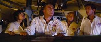Movie still from “Fantastic Voyage” (1966), directed by Richard Fleischer – Two men in white lab coats looking up at something; Medium shot, Low angle