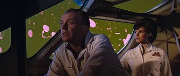 Movie still from “Fantastic Voyage” (1966), directed by Richard Fleischer – A man sitting in the driver's seat of a car; Medium shot, Low angle
