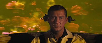 Movie still from “Fantastic Voyage” (1966), directed by Richard Fleischer – A man wearing a yellow jacket with a yellow background; Close Up shot, Low angle