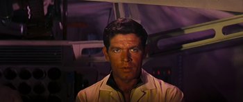 Movie still from “Fantastic Voyage” (1966), directed by Richard Fleischer – A man that is staring at the camera; Close Up shot, Over the shoulder angle