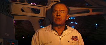 Movie still from “Fantastic Voyage” (1966), directed by Richard Fleischer – A person in a room with lights in the background; Medium shot, Over the shoulder angle