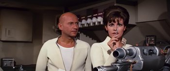 Movie still from “Fantastic Voyage” (1966), directed by Richard Fleischer – A man and a woman standing next to each other; Close Up shot, Low angle