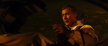 Movie still from “Fantastic Voyage” (1966), directed by Richard Fleischer – A man is holding a microphone in his hand; Close Up shot, High angle