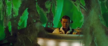 Movie still from “Fantastic Voyage” (1966), directed by Richard Fleischer – A man in a yellow shirt is in front of a green screen; Medium shot, Low angle