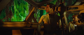 Movie still from “Fantastic Voyage” (1966), directed by Richard Fleischer – A man standing next to a window in a room; Medium shot, Low angle