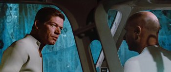 Movie still from “Fantastic Voyage” (1966), directed by Richard Fleischer – A person in a car looking out a window; Close Up shot, Low angle