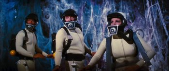 Movie still from “Fantastic Voyage” (1966), directed by Richard Fleischer – A couple of people that are in a room; Medium shot, Low angle