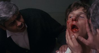 Movie still from “Fat City” (1972), directed by John Huston – A man and a woman with blood all over their face; Close Up shot, Low angle