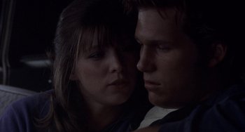 Movie still from “Fat City” (1972), directed by John Huston – A man and a woman looking into each others eyes; Close Up shot, Over the shoulder angle