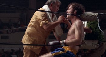 Movie still from “Fat City” (1972), directed by John Huston – A man in a boxing ring getting ready for a fight; Medium shot, Low angle