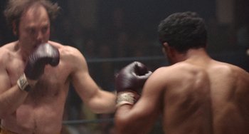 Movie still from “Fat City” (1972), directed by John Huston – Two boxers in a boxing ring during a match; Close Up shot, Over the shoulder angle