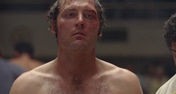 Movie still from “Fat City” (1972), directed by John Huston – A person with a bruise on his face; Close Up shot, Low angle