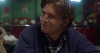 Movie still from “Fat City” (1972), directed by John Huston – A person sitting at a table; Close Up shot, Over the shoulder angle