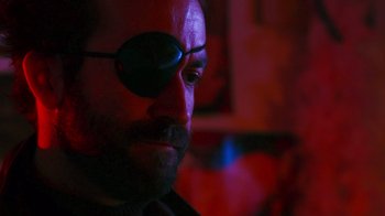 Movie still from “Father's Day” (2011), directed by Conor Sweeney – A person wearing a pair of sunglasses; Close Up shot, Low angle