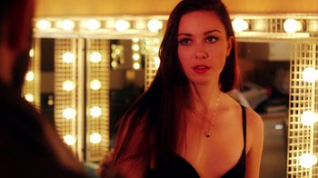 Movie still from “Father's Day” (2011), directed by Conor Sweeney – A beautiful young lady standing in front of a mirror; Close Up shot, Over the shoulder angle