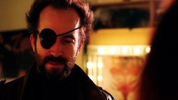 Movie still from “Father's Day” (2011), directed by Conor Sweeney – A person wearing a eye patch; Close Up shot, Low angle
