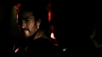 Movie still from “Father's Day” (2011), directed by Conor Sweeney – A person wearing a jacket; Close Up shot, Over the shoulder angle