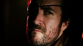 Movie still from “Father's Day” (2011), directed by Conor Sweeney – A person wearing a eye patch; Extreme Close Up shot, Low angle
