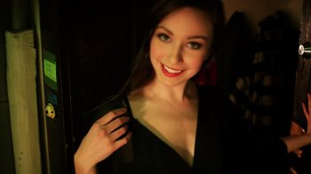Movie still from “Father's Day” (2011), directed by Conor Sweeney – A beautiful young woman holding a hair brush; Close Up shot, High angle