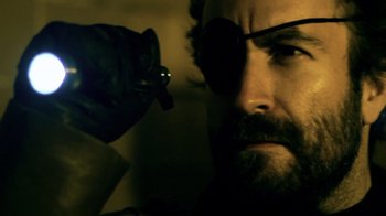 Movie still from “Father's Day” (2011), directed by Conor Sweeney – A person wearing a pair of sunglasses; Close Up shot, Low angle