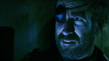 Movie still from “Father's Day” (2011), directed by Conor Sweeney – A person wearing a pair of eye glasses; Close Up shot, Over the shoulder angle