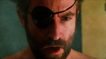 Movie still from “Father's Day” (2011), directed by Conor Sweeney – A person wearing a eye patch; Close Up shot, Low angle