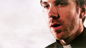 Movie still from “Father's Day” (2011), directed by Conor Sweeney – A man's face with a white background; Close Up shot, Low angle