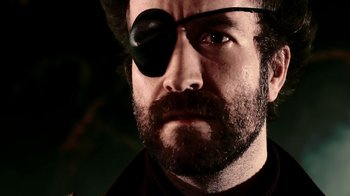 Movie still from “Father's Day” (2011), directed by Conor Sweeney – A person wearing a eye patch; Extreme Close Up shot, Low angle