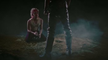 Movie still from “Father's Day” (2011), directed by Conor Sweeney – A woman sitting on the ground next to another woman; Wide shot, High angle