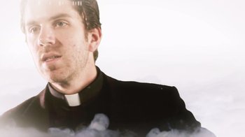 Movie still from “Father's Day” (2011), directed by Conor Sweeney – A man wearing a priest's collar is looking at the camera; Close Up shot, Low angle