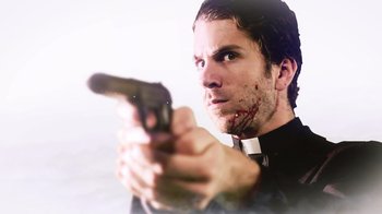 Movie still from “Father's Day” (2011), directed by Conor Sweeney – A man in a priest's outfit is holding a gun; Close Up shot, Low angle
