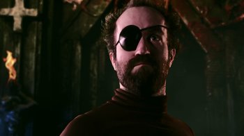 Movie still from “Father's Day” (2011), directed by Conor Sweeney – A man wearing a pirate eye patch and a red shirt; Close Up shot, Low angle
