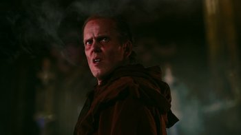 Movie still from “Father's Day” (2011), directed by Conor Sweeney – A person wearing a hooded jacket; Close Up shot, Low angle