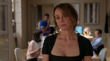 Movie still from “Emily in Paris” (2020), created by Darren Star – A person wearing a black shirt; Close Up shot, Over the shoulder angle