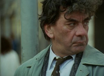 Movie still from “Faust” (1994), directed by Jan Svankmajer – A person wearing a suit and tie; Close Up shot, Low angle