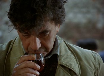 Movie still from “Faust” (1994), directed by Jan Svankmajer – A man drinking a glass of wine from a wine glass; Close Up shot, Over the shoulder angle